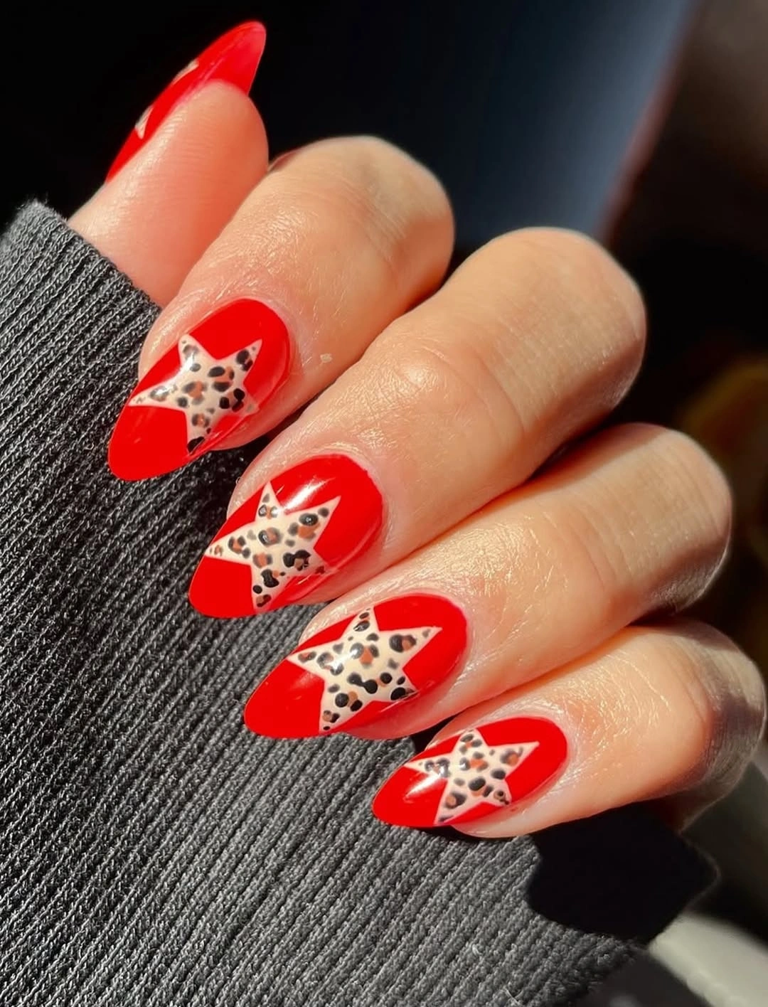 Red French nails with leopard accents