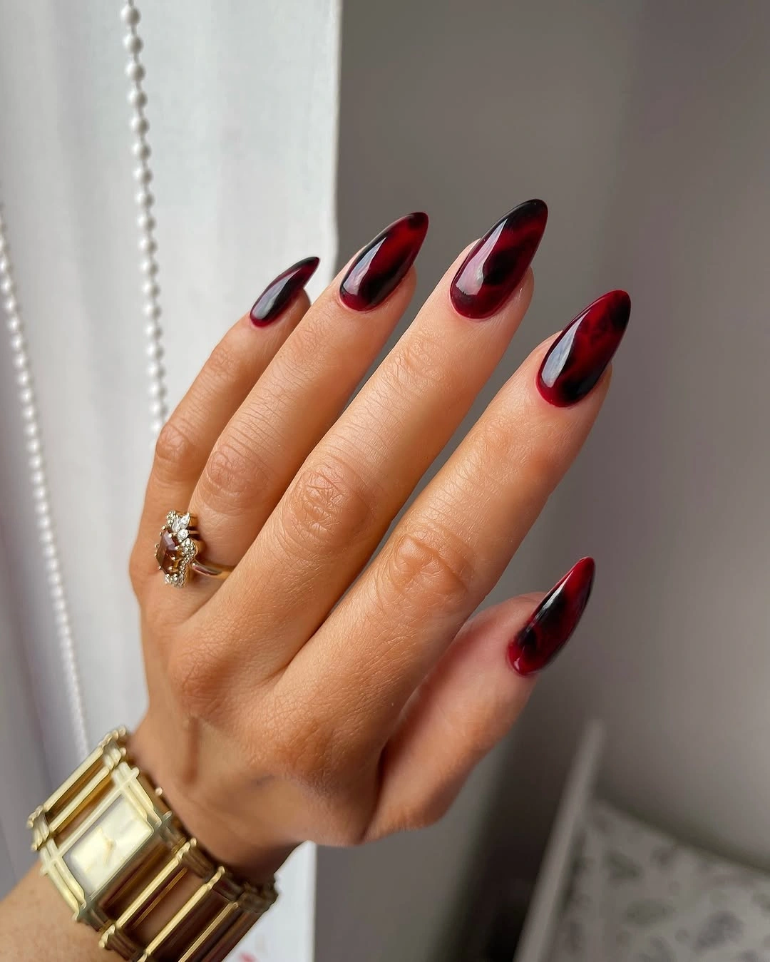 Deep red nails with black gradient tips