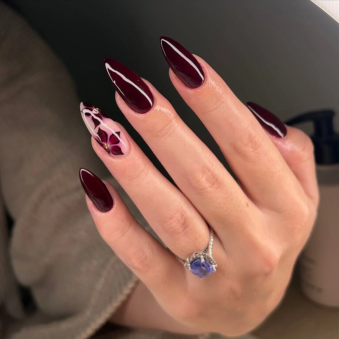 Burgundy nails with pink leopard accent