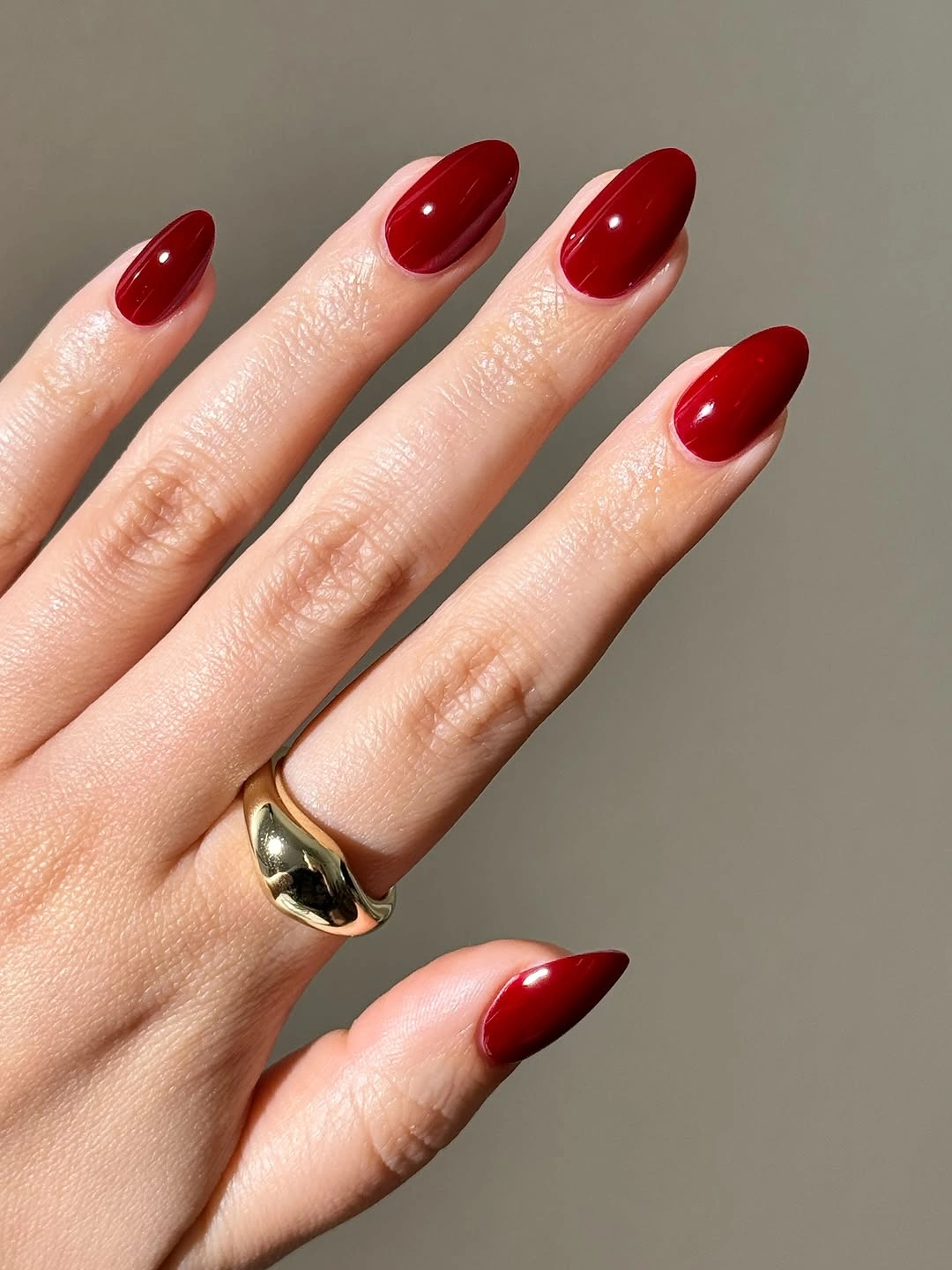Clean cherry red almond nails