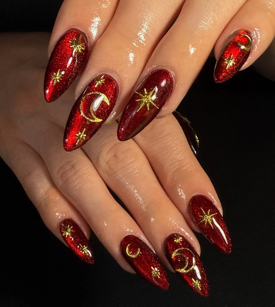 Red glitter celestial stiletto nails