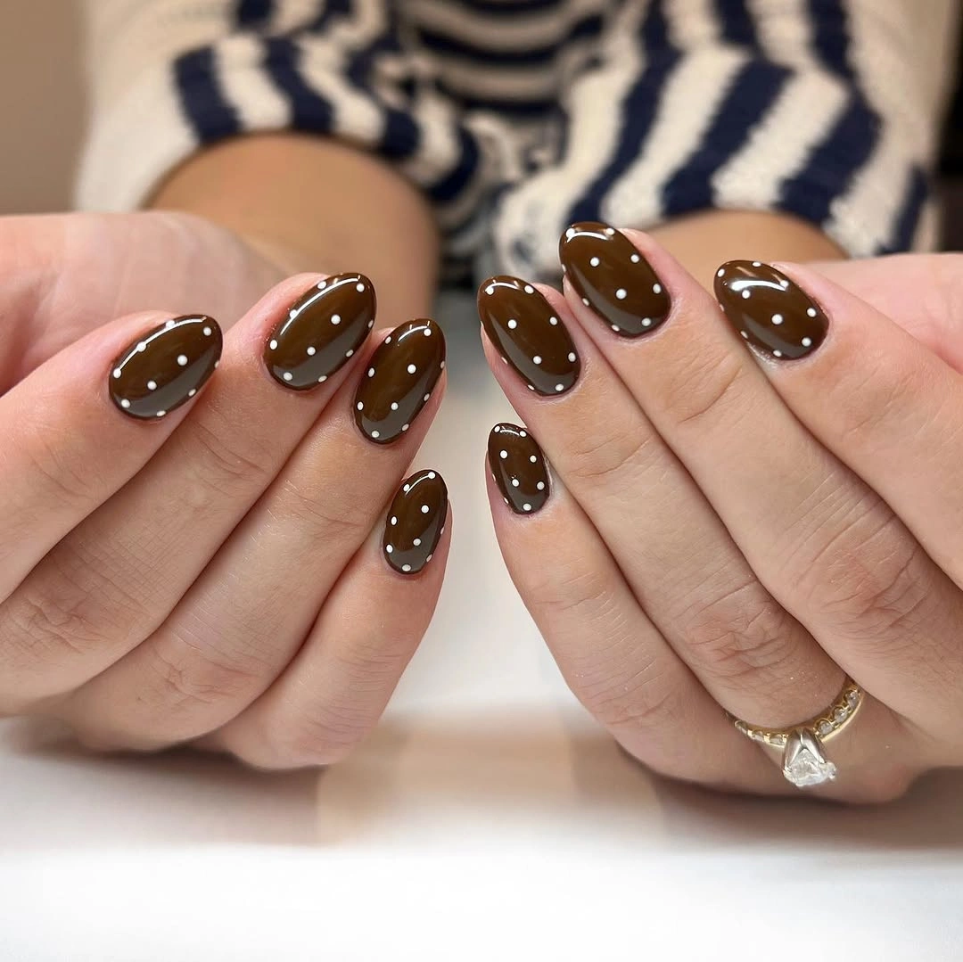 short chocolate almond nails with cream dots