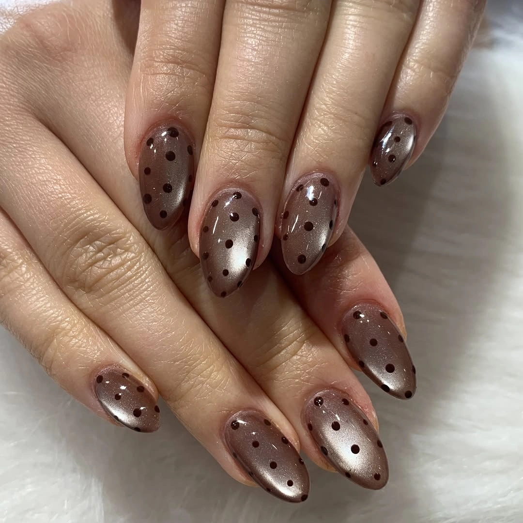 short burgundy almond nails with tiny cream flowers