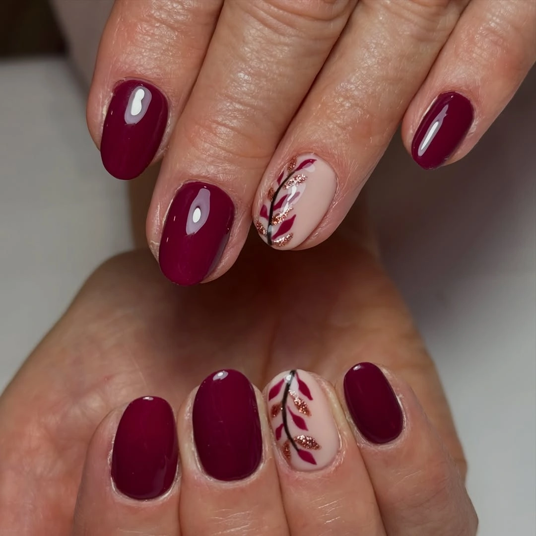 short black and burgundy almond nails with glossy finish