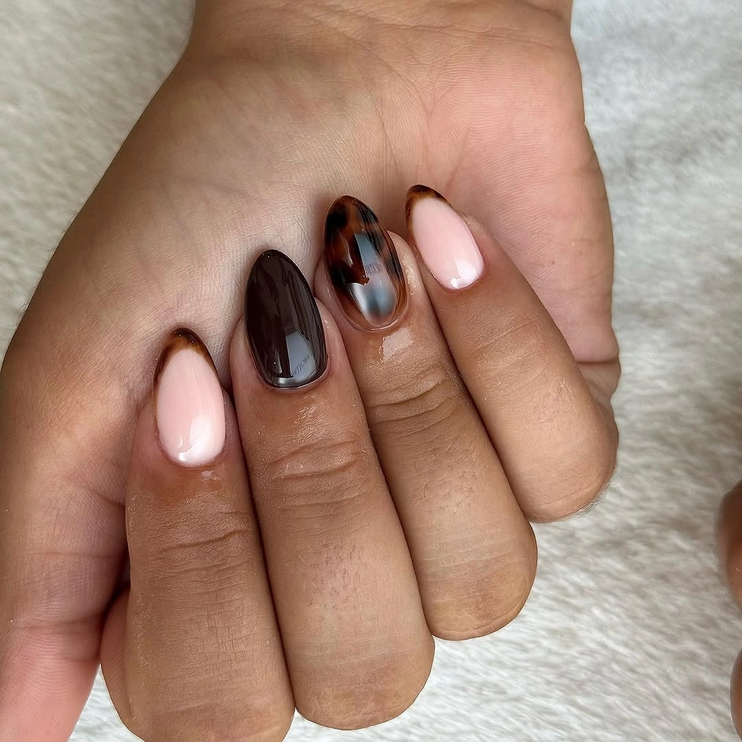 short almond nails with brown nude and chrome accents