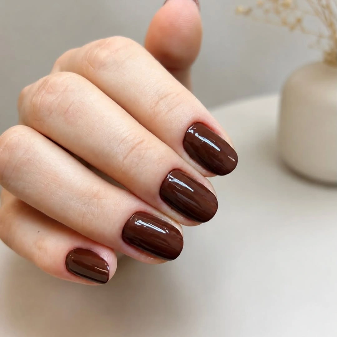 short almond nails with chocolate French tips