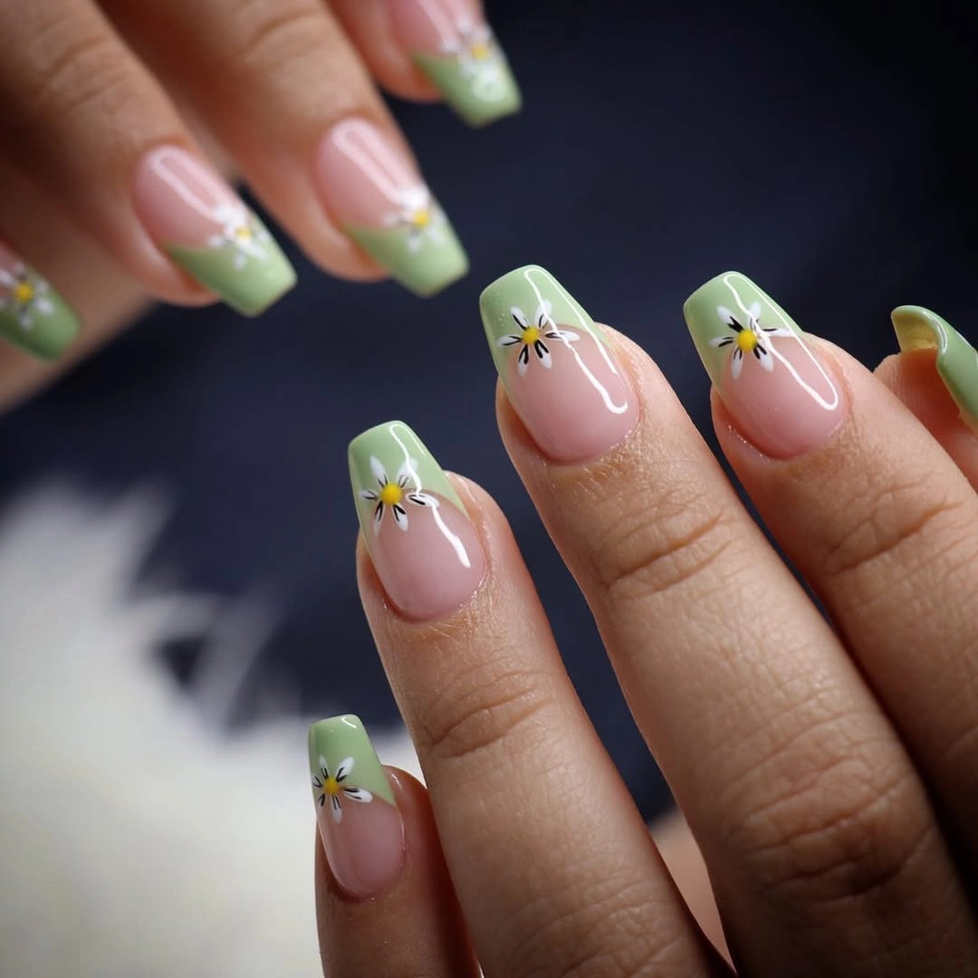 short nude coffin nails with pale green tips and flowers