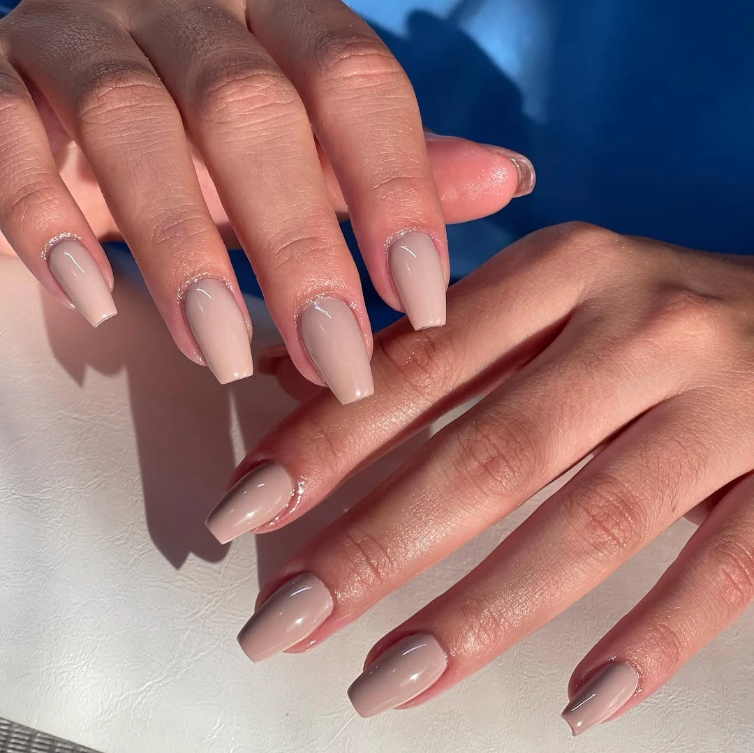 long milky nude nails on a square silhouette