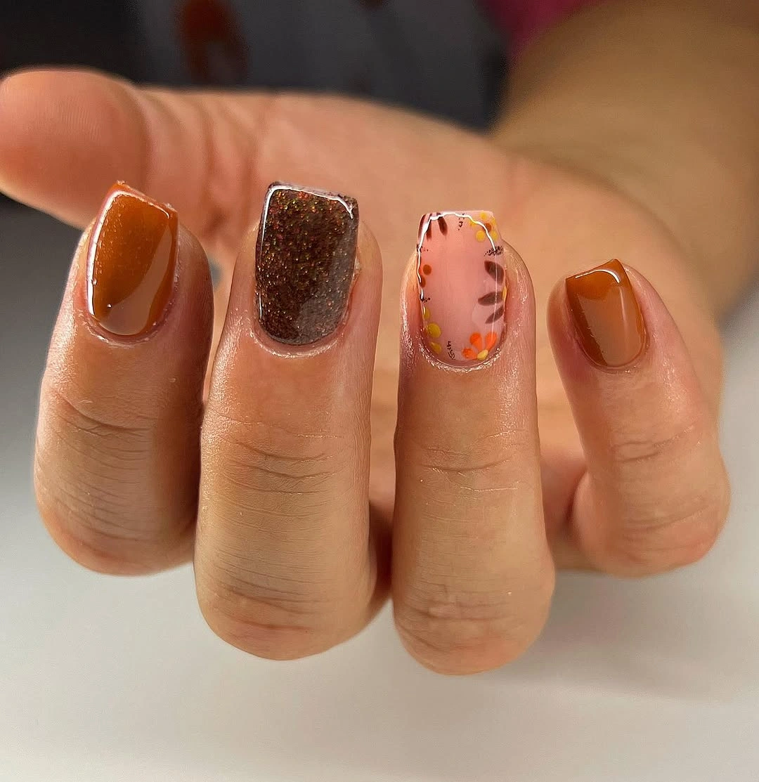 Short square brown copper nails with pale botanical glitter