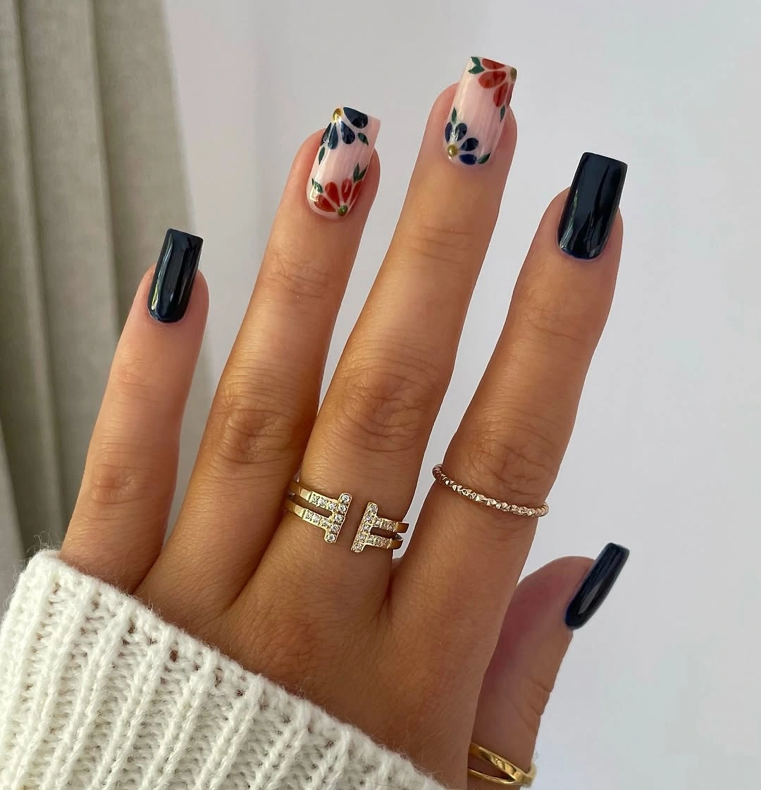 Long square black nails with pale floral accents