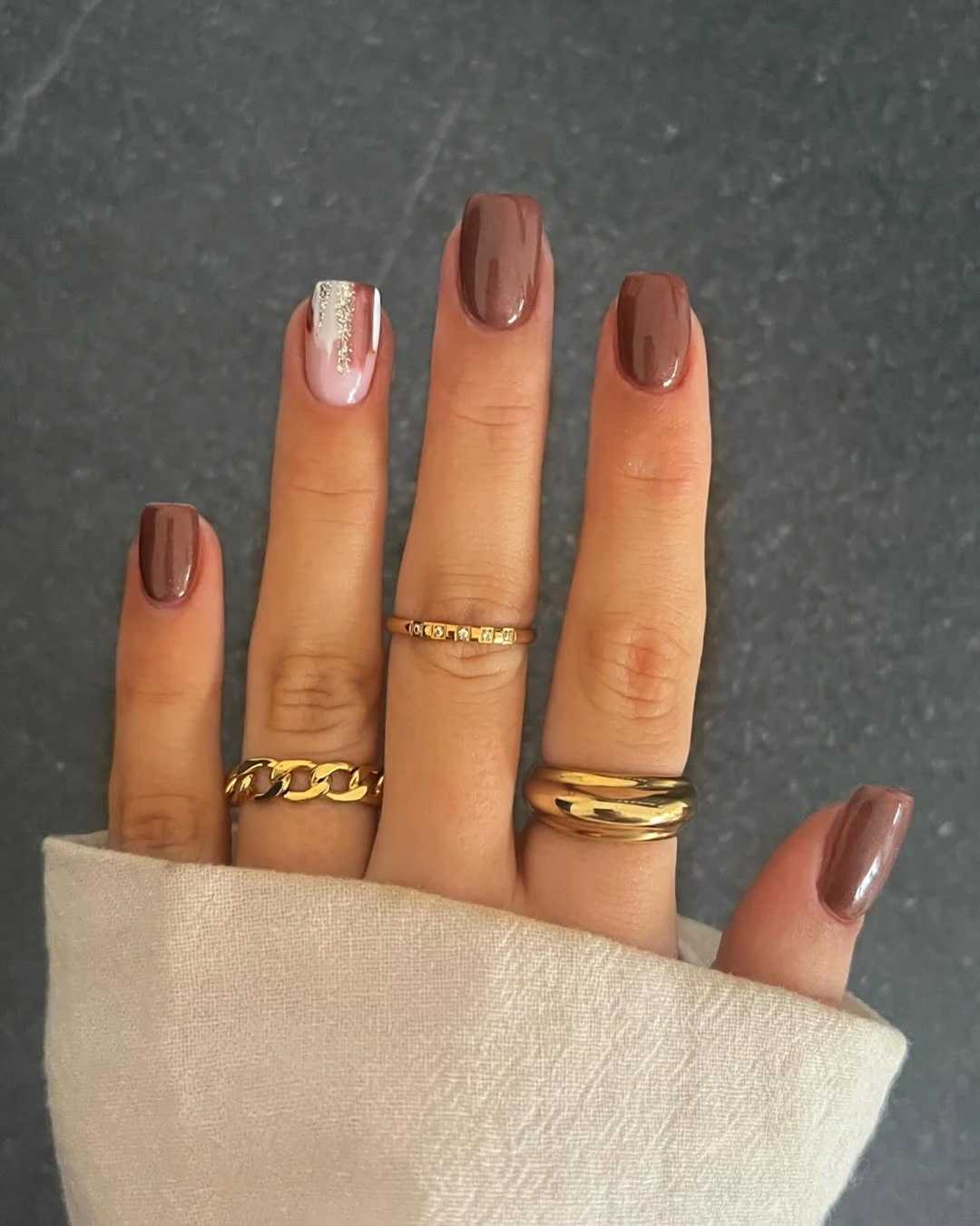 Short square warm taupe nails with minimal accents