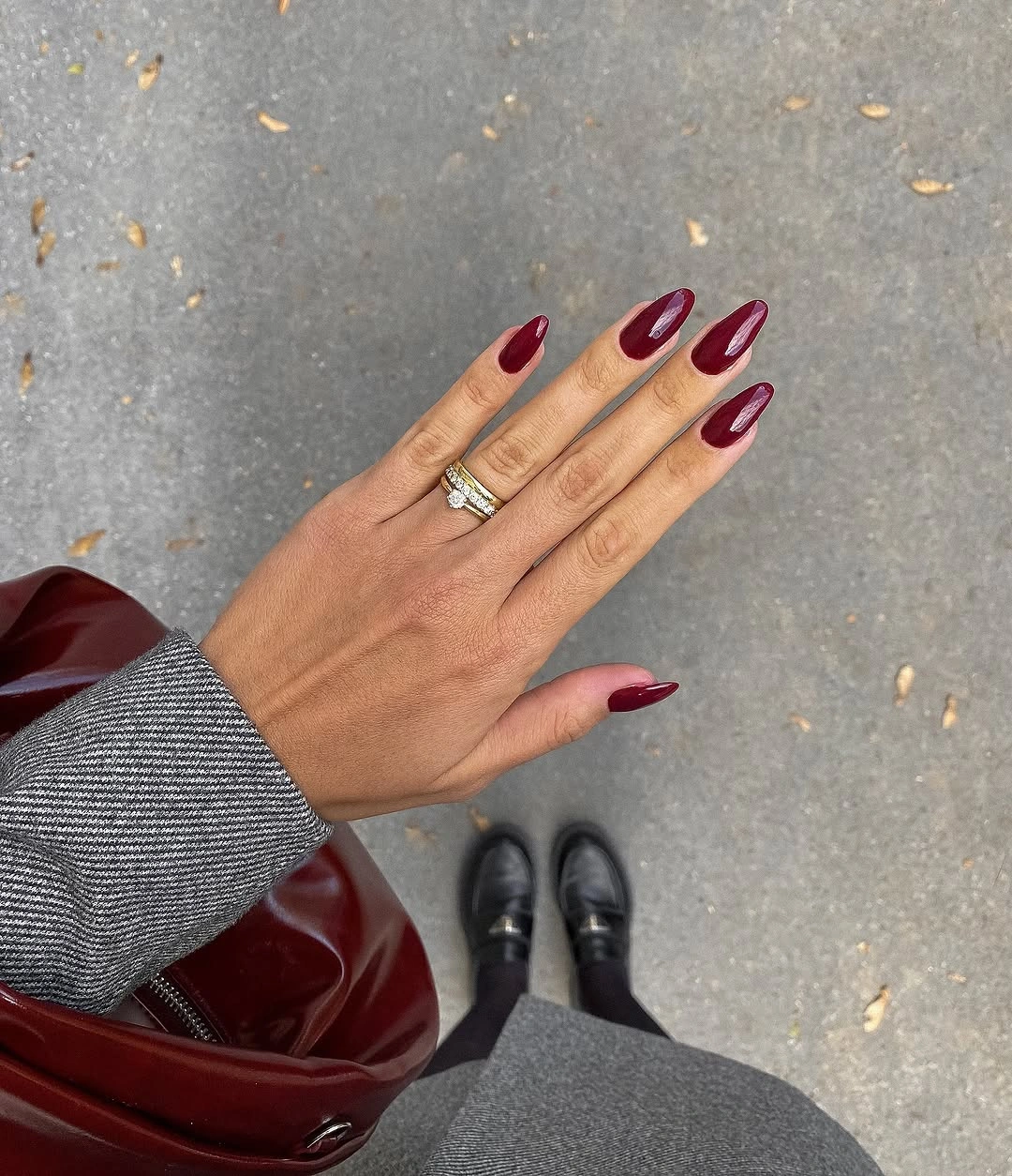 burgundy French tips on a sheer blush almond manicure
