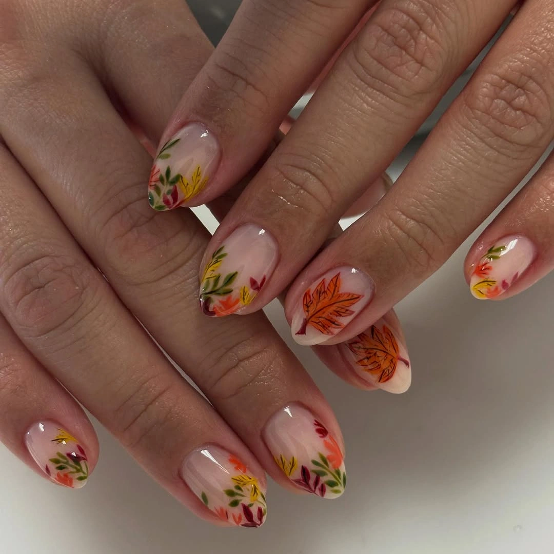 sheer nude nails with tiny warm floral accents