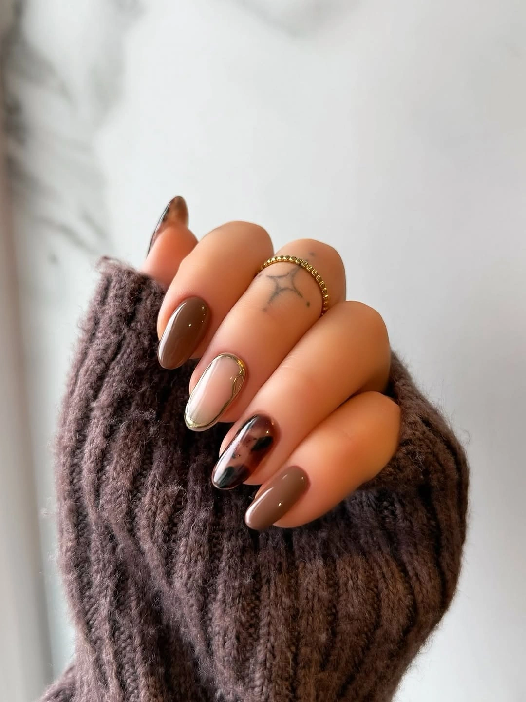 caramel brown French curves over pale almond nails