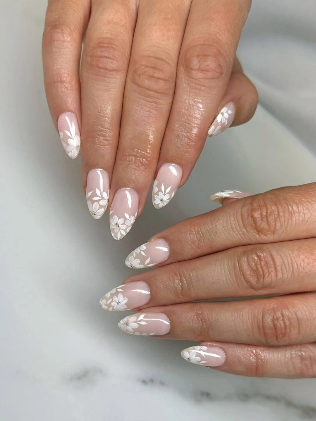 cream almond nails with curved brown French tips