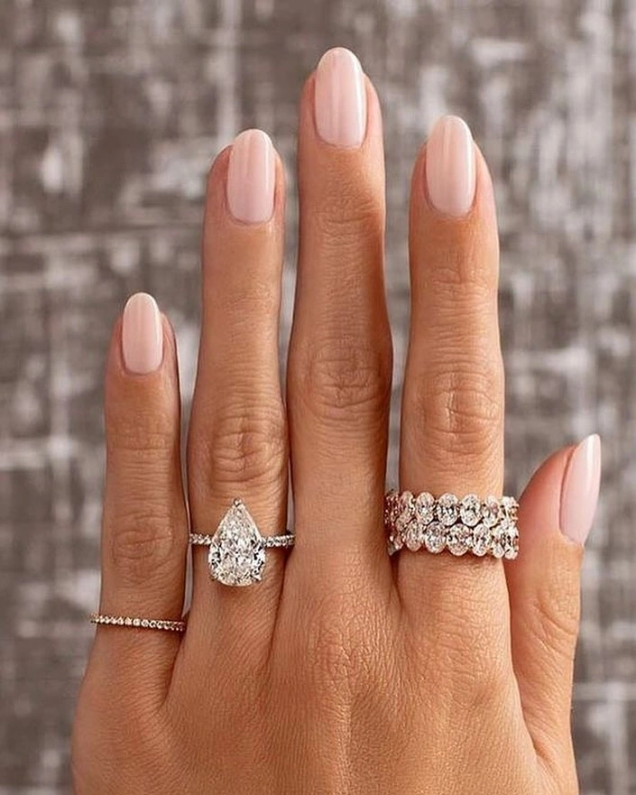 white floral nails with black checker accents