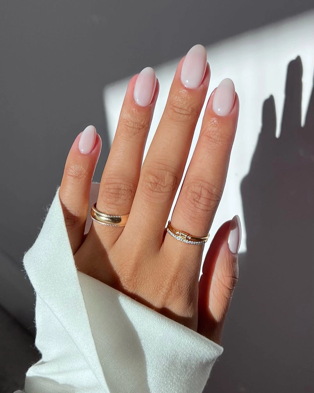 pale pink nails with a clean white French edge