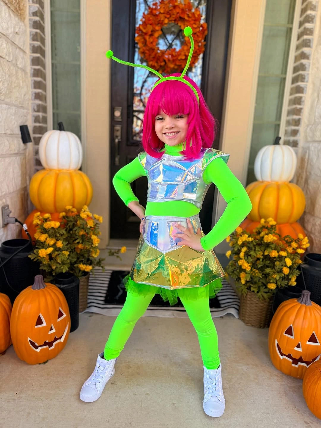 neon green outfit with fitted bright base with metallic crop top and short skirt
