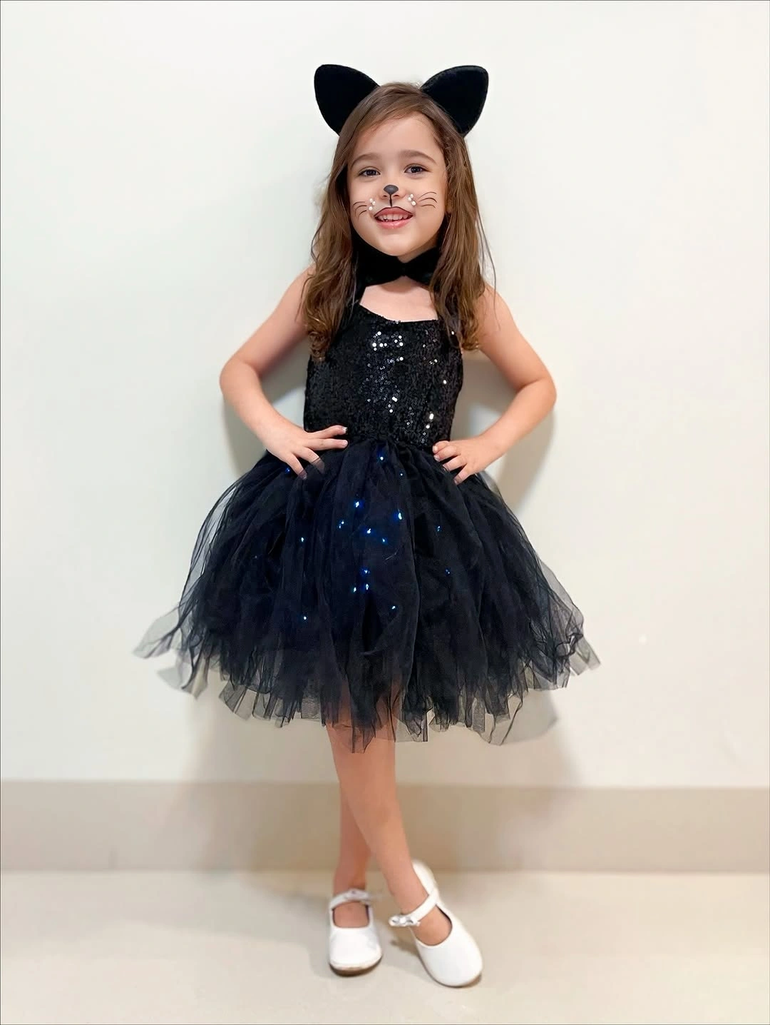 black outfit with full short tulle skirt with fitted sleeveless bodice and cat ears