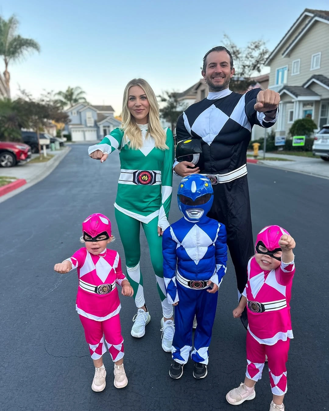green outfit with fitted full-body suits with belts and graphic chest panels