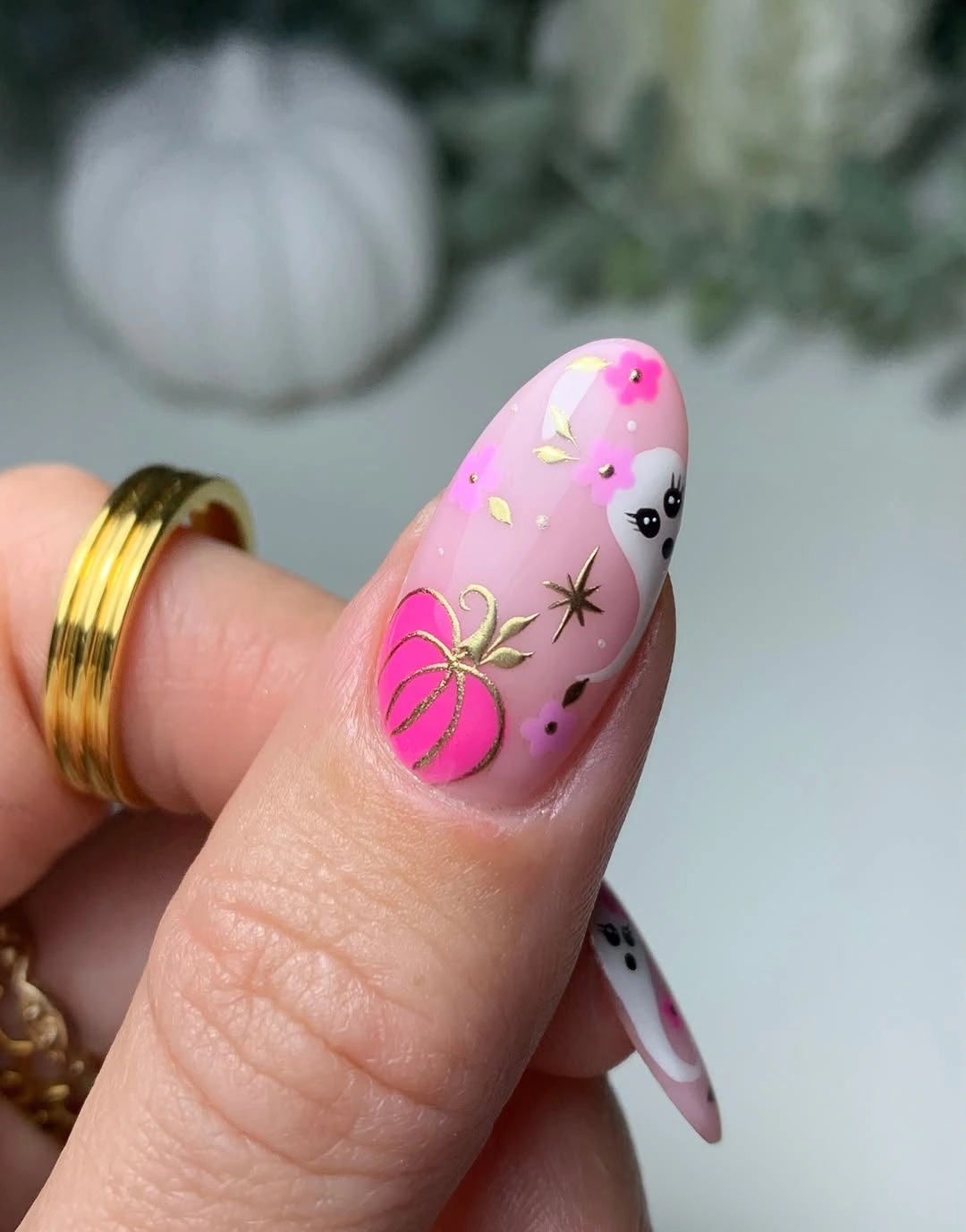 Long almond bright pink nails with pumpkins ghosts and stars