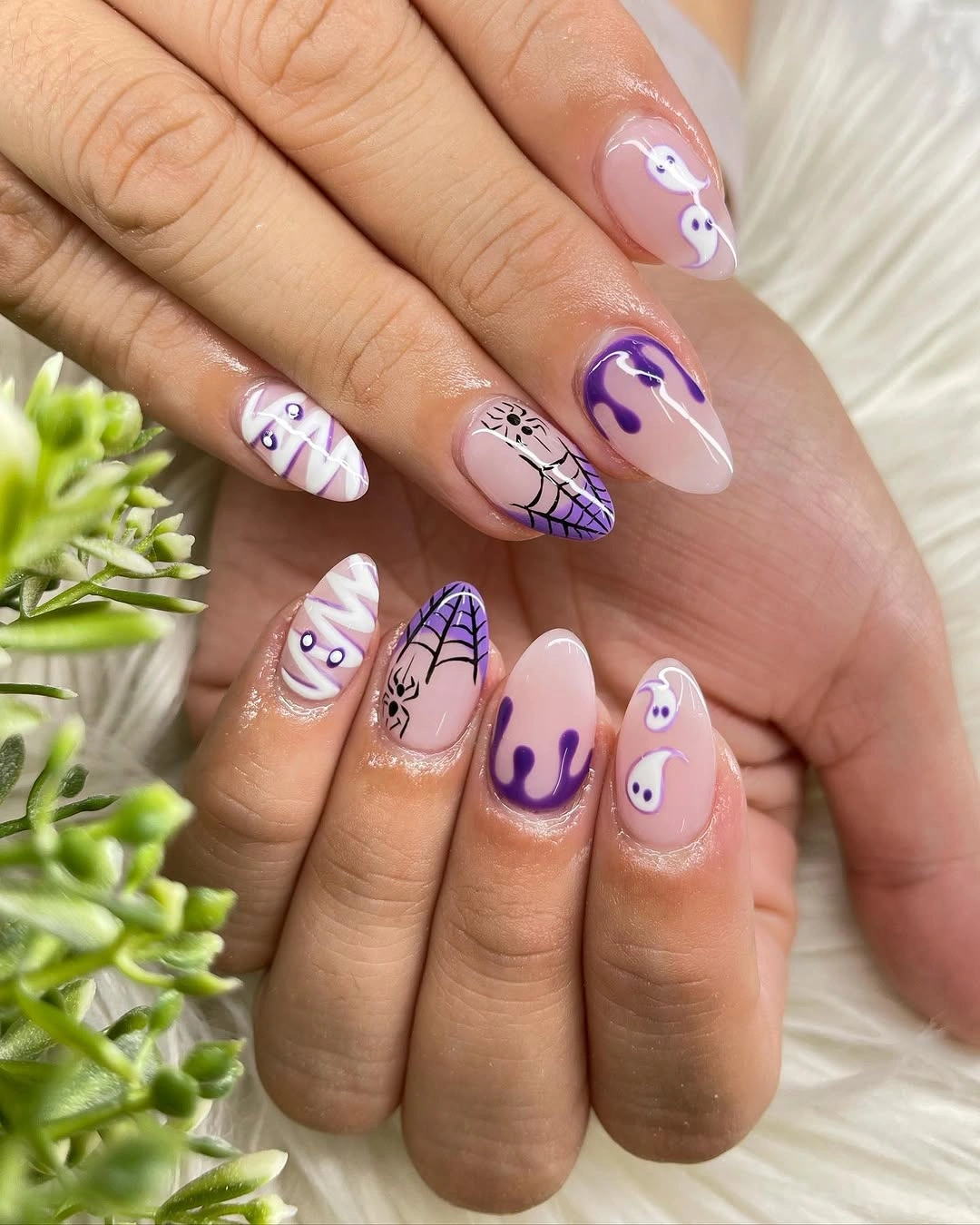 Medium almond lavender nails with purple ghosts webs and swirls