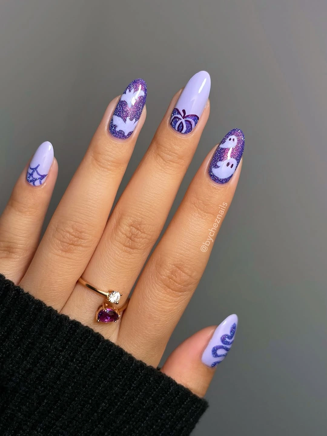 Long almond lavender nails with purple ghosts and spooky marks
