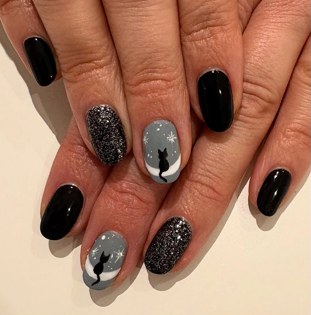 Medium almond black gray pink nails with glitter faces