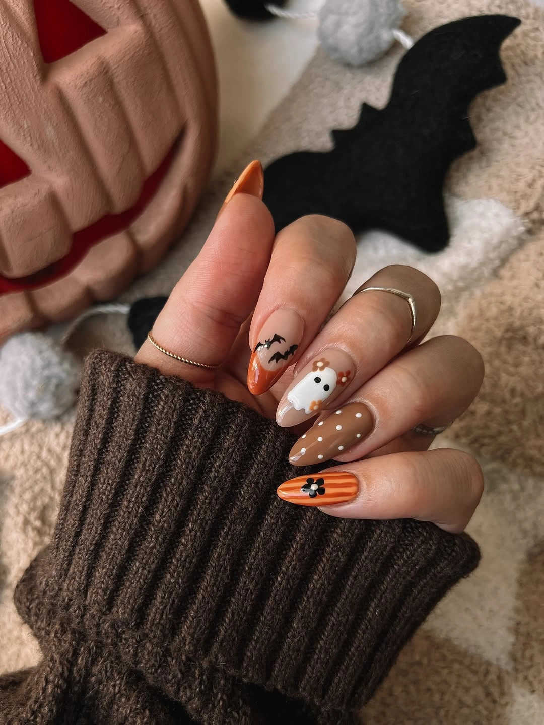 Medium almond brown cream nails with ghosts and web details