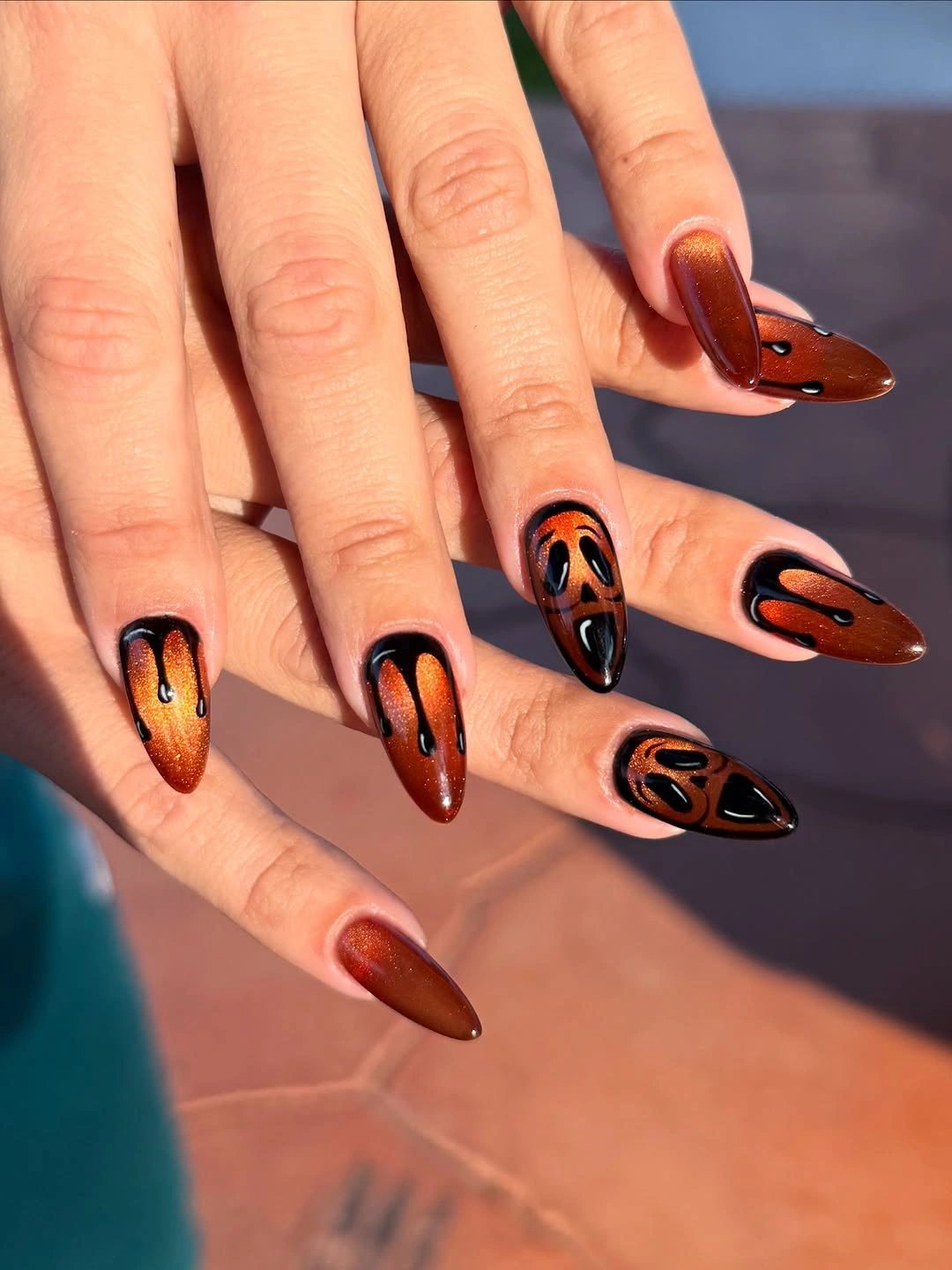 Long almond dark red black nails with amber graphic faces