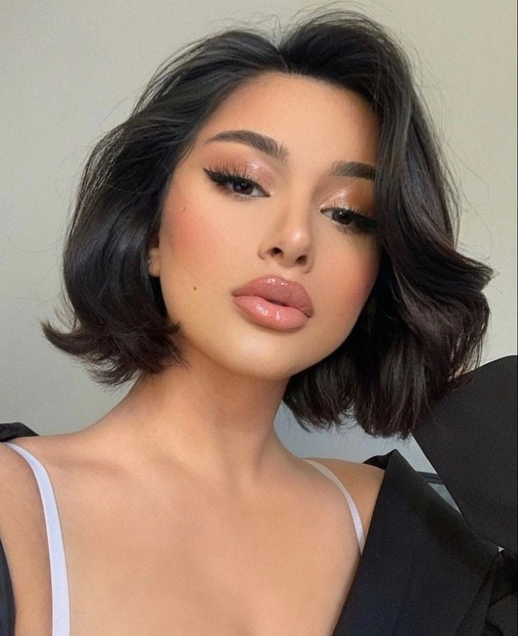 short rounded dark bob with a centered part