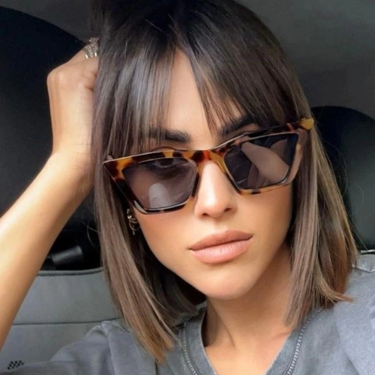 short taupe-brown lob with center-parted front pieces