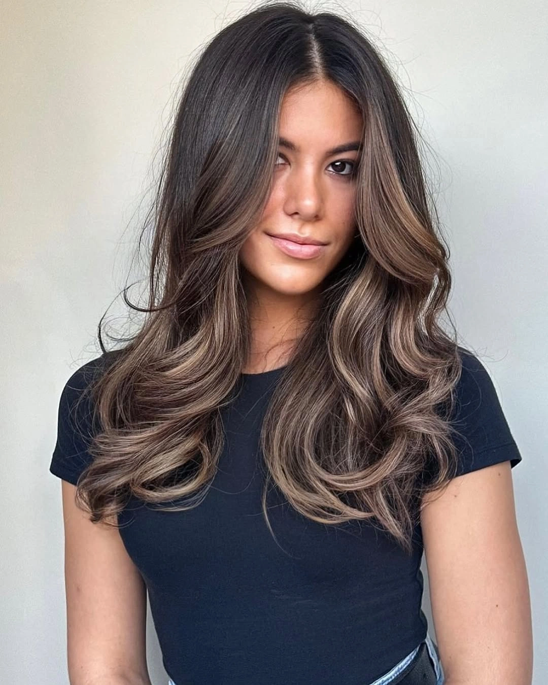 long brunette layered waves with a balanced middle part