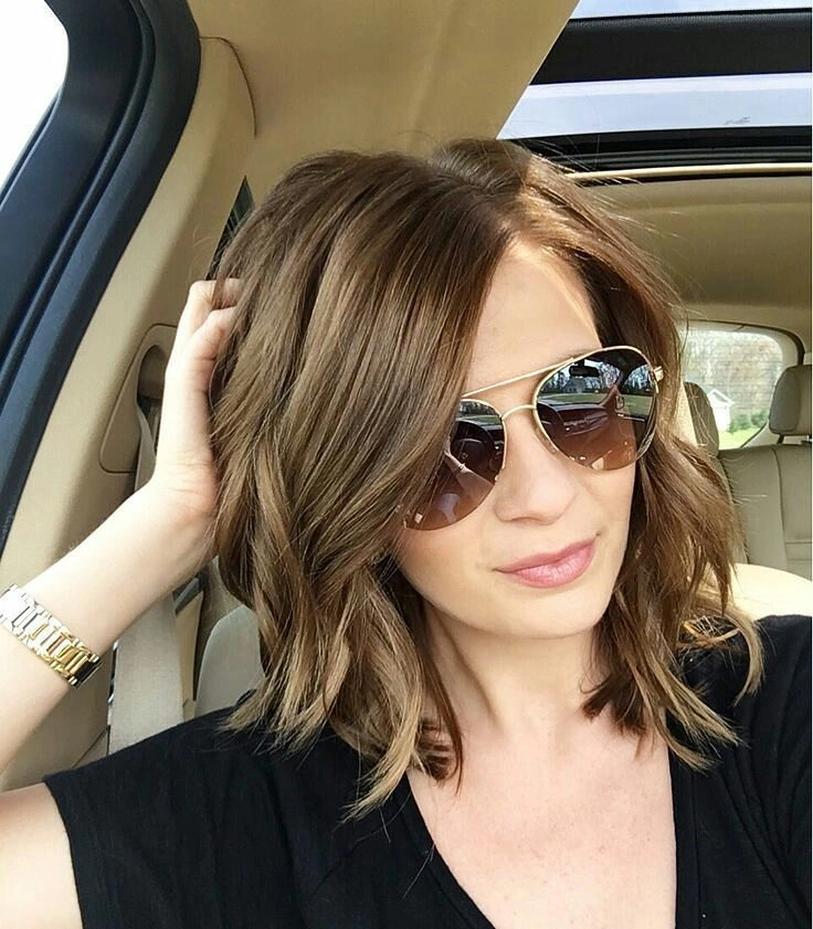 warm brown center-parted lob with loose waves