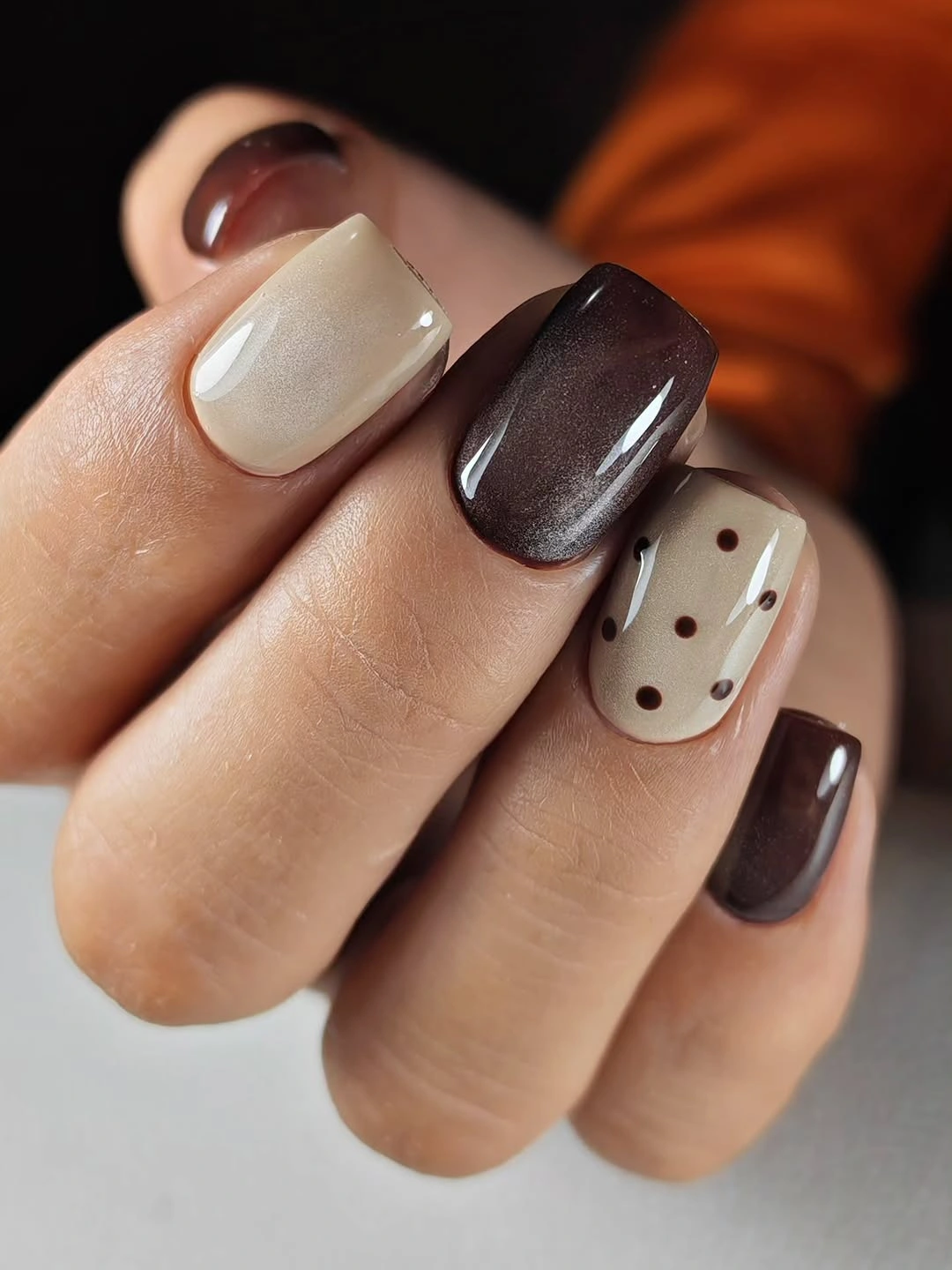 Short square ivory chocolate nails with tiny dark dots