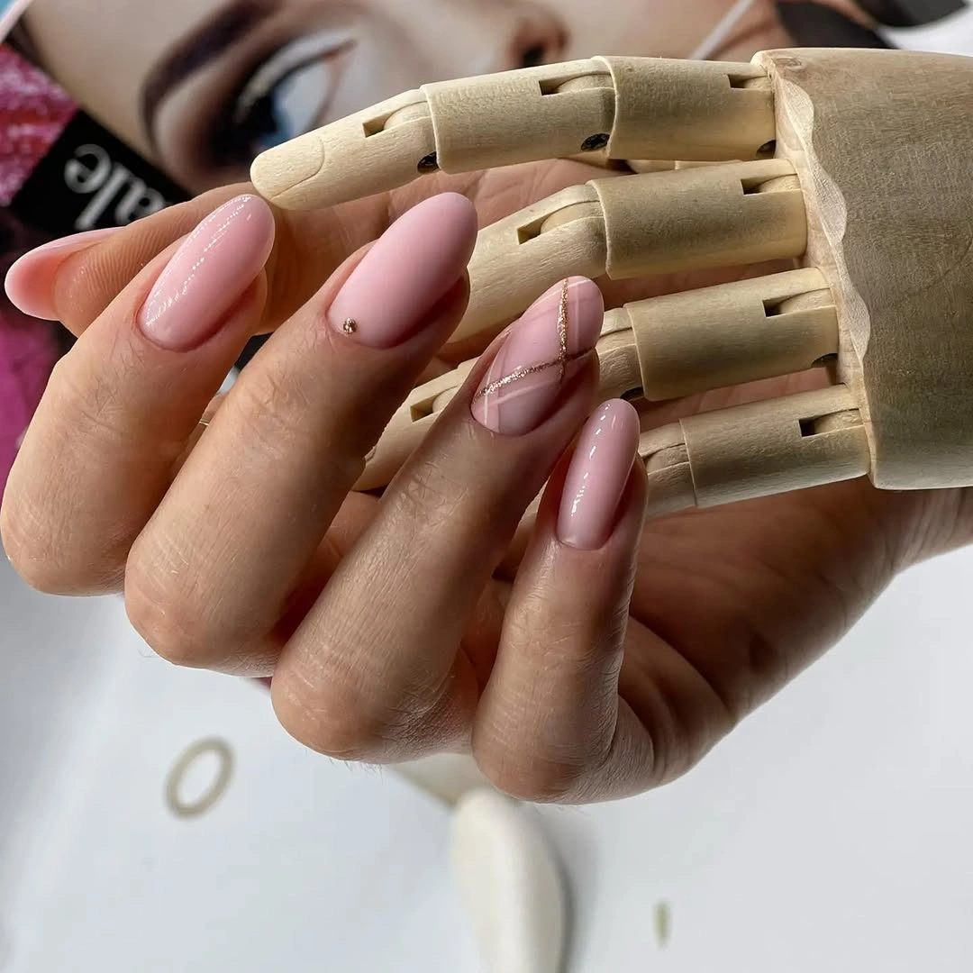 Long almond pale pink nails with fine white warm lines