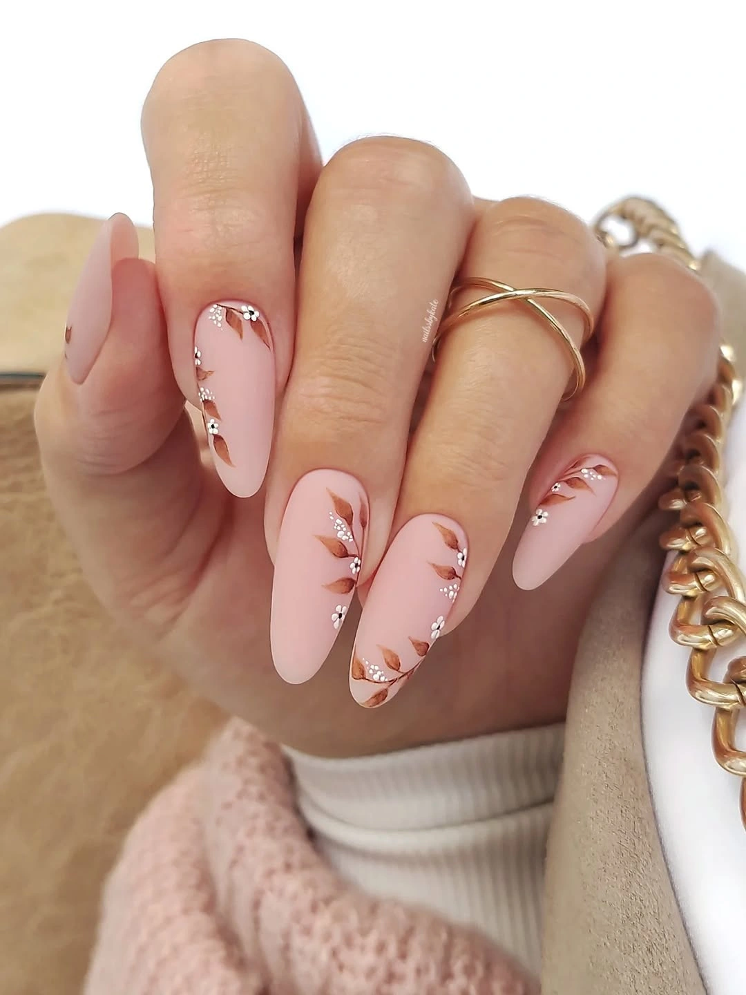 Medium almond pale pink nails with tiny warm edge accents