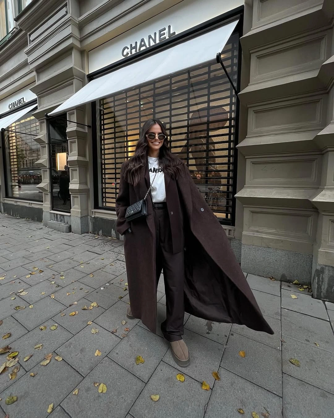 chocolate brown outfit with long oversized coat over relaxed trousers