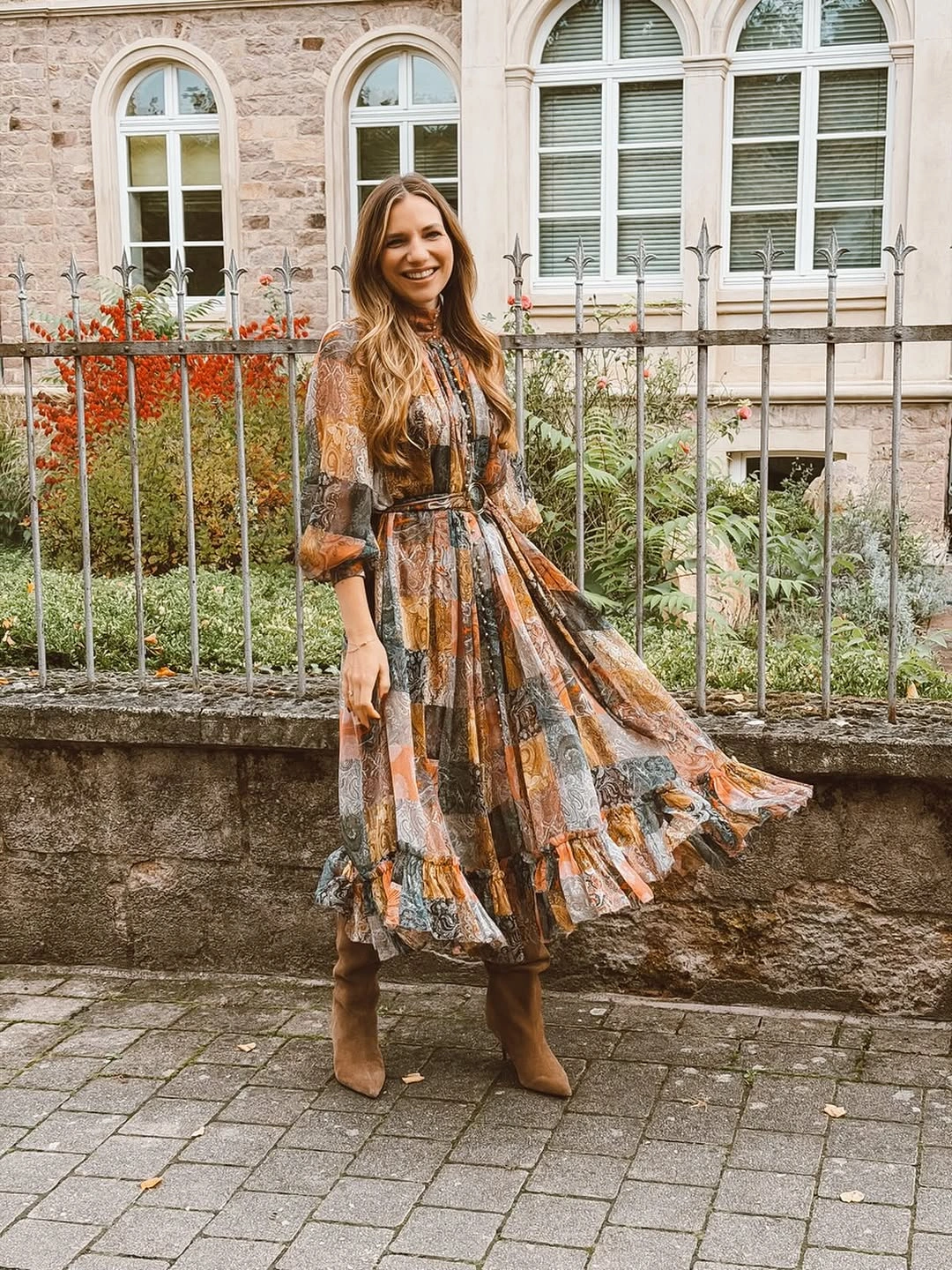 rust outfit with long-sleeve waist-defined midi dress with flared skirt