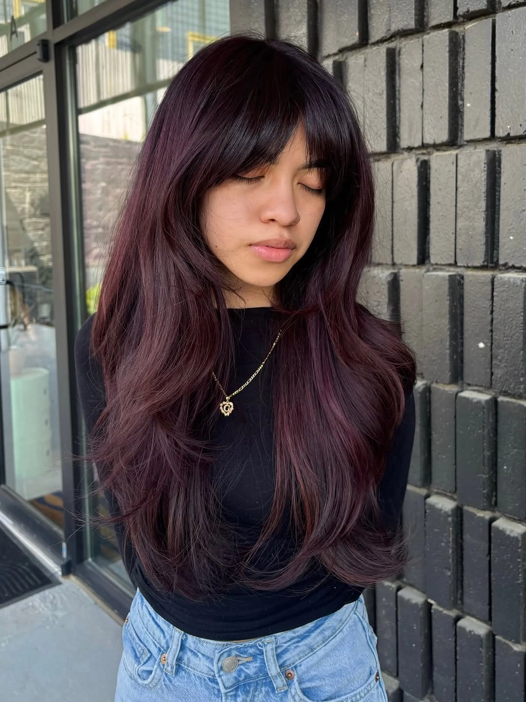 deep plum long layered waves with curtain fringe with tonal plum color