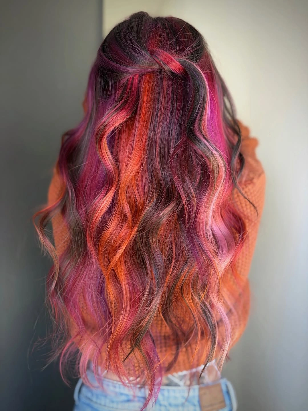 dark brown long layered waves with half-up detail with pink and red ribbons