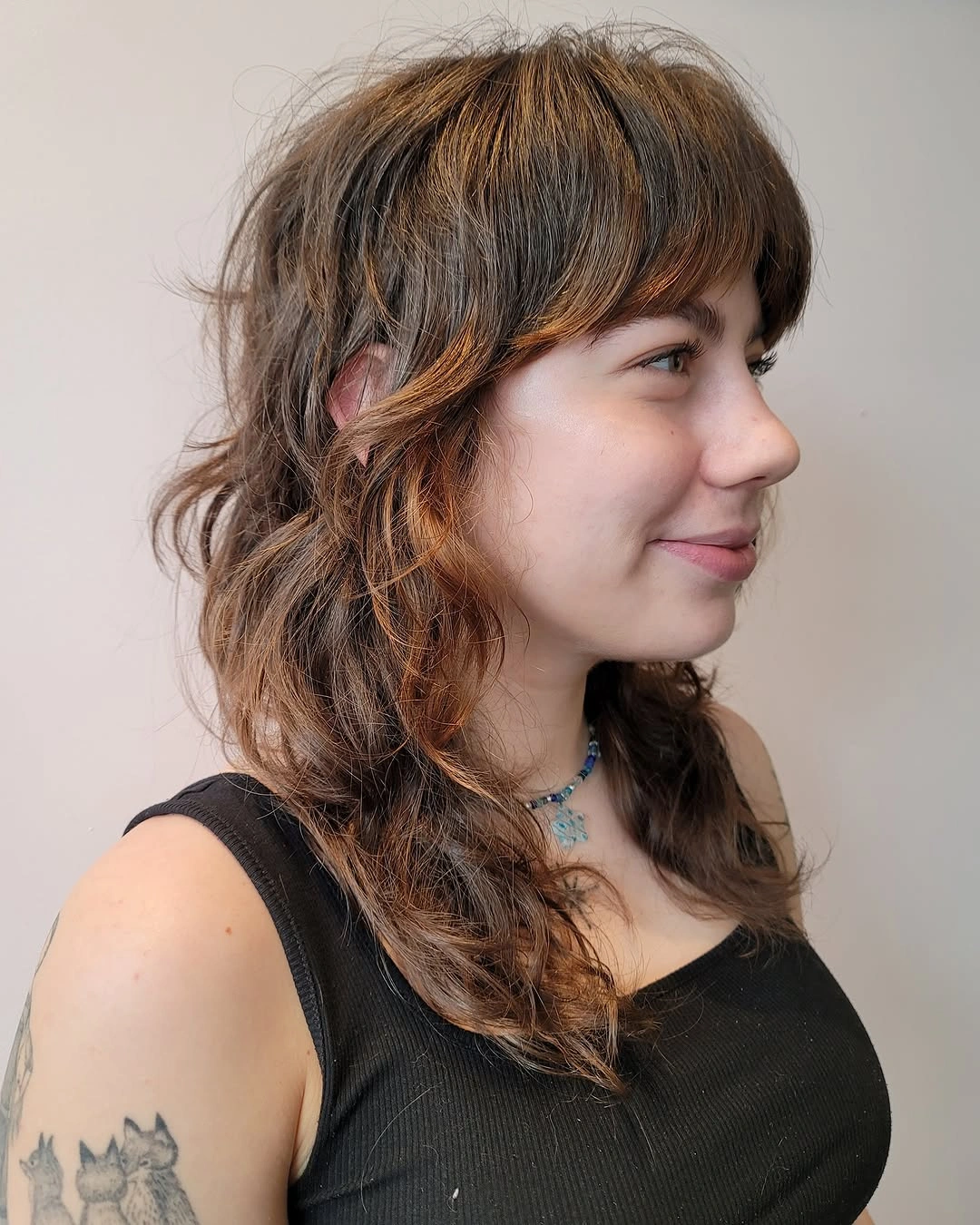 medium brown medium shag with full fringe with full bangs