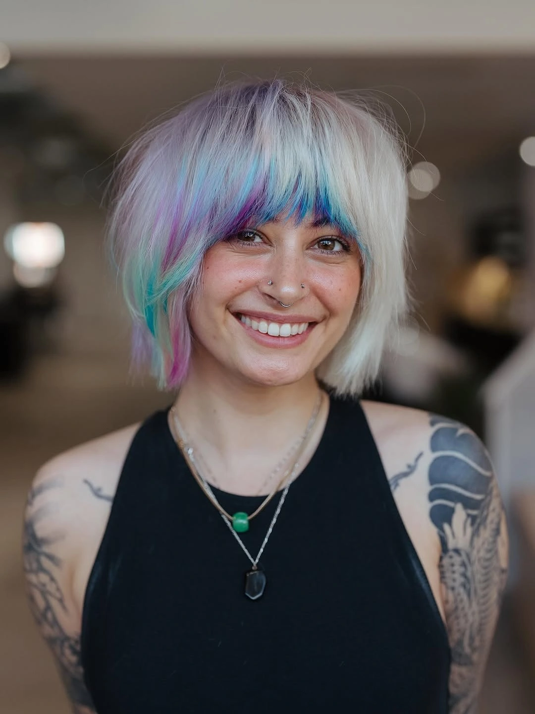 silver short textured bob with fringe with pastel panel accents