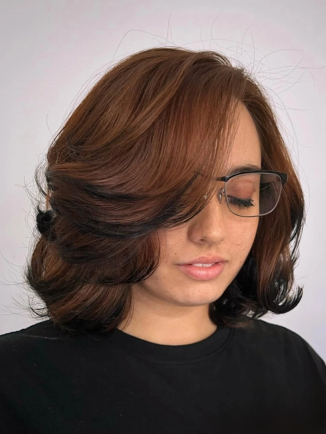 dark brown shoulder-length layered bob with side fringe with side-swept fringe
