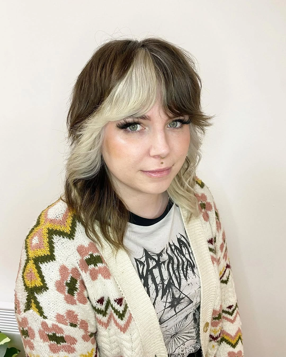 dark brown medium-long wolf cut with fringe with blonde face frame