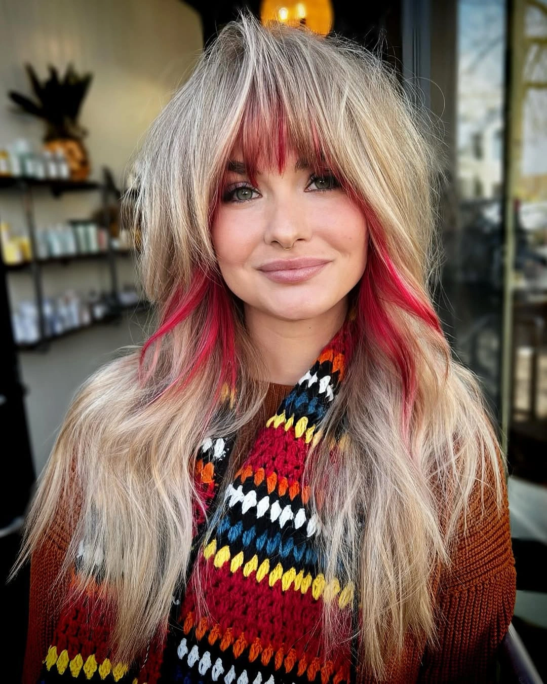 blonde long layered cut with curtain fringe with pink-red face panels