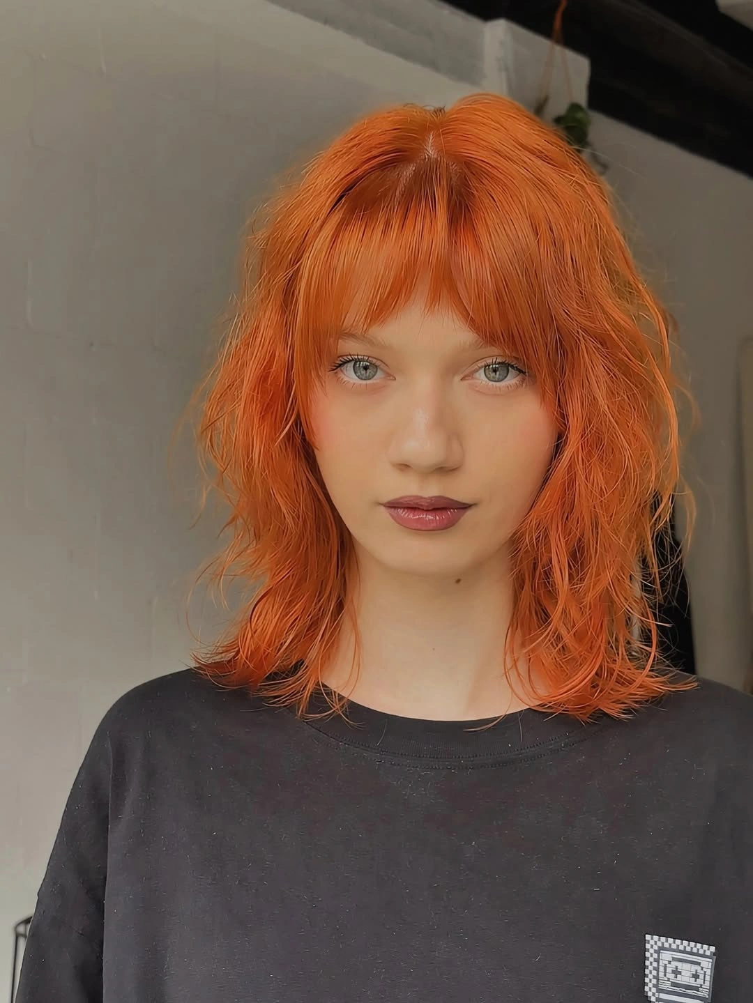 copper orange medium choppy bob with short fringe with short fringe