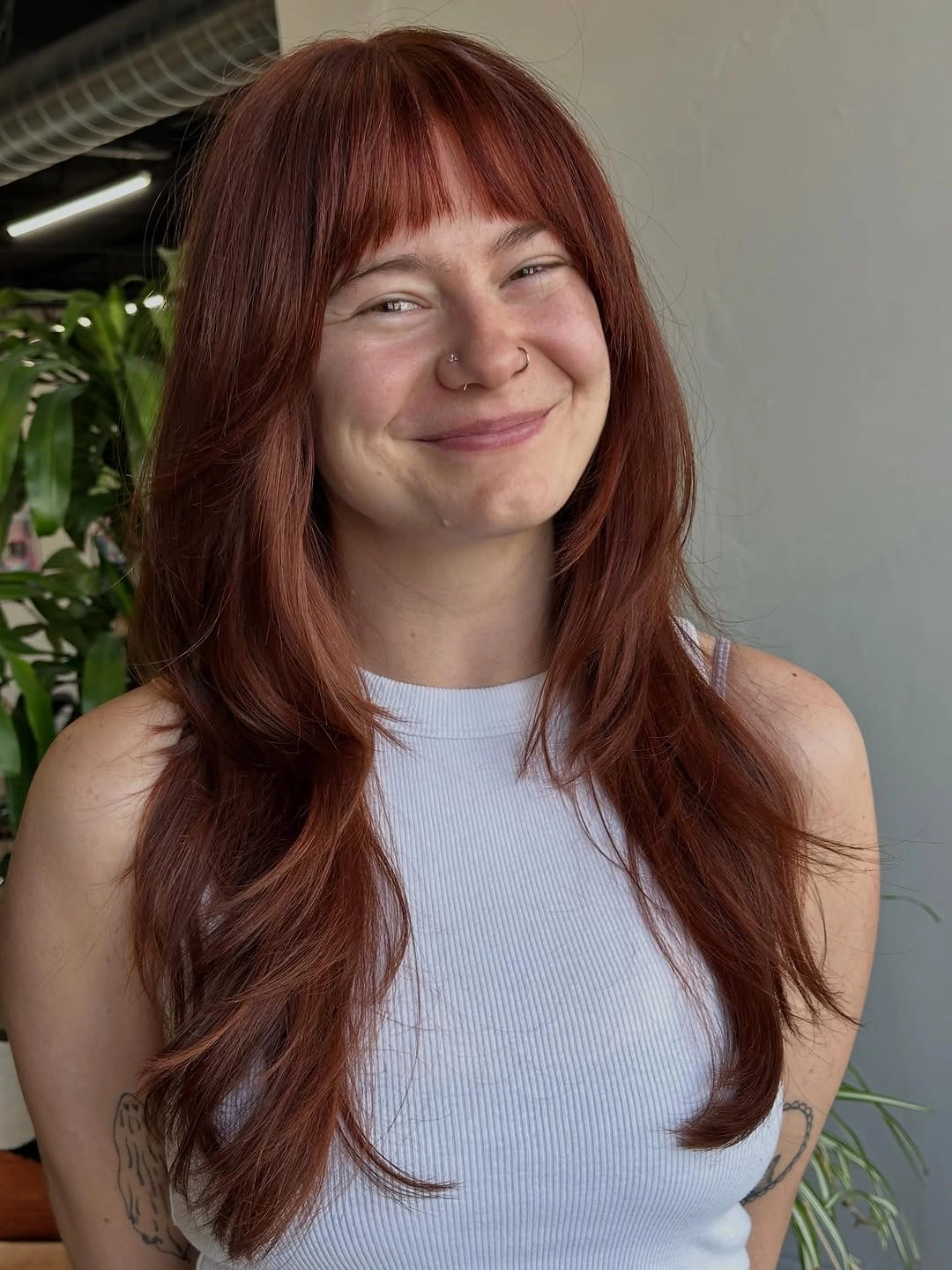 auburn red long layered cut with full fringe with full fringe