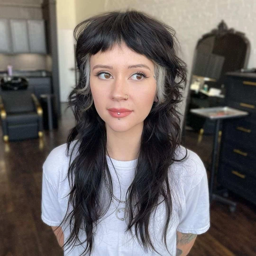 dark brown long shag with wispy fringe with short wispy bangs