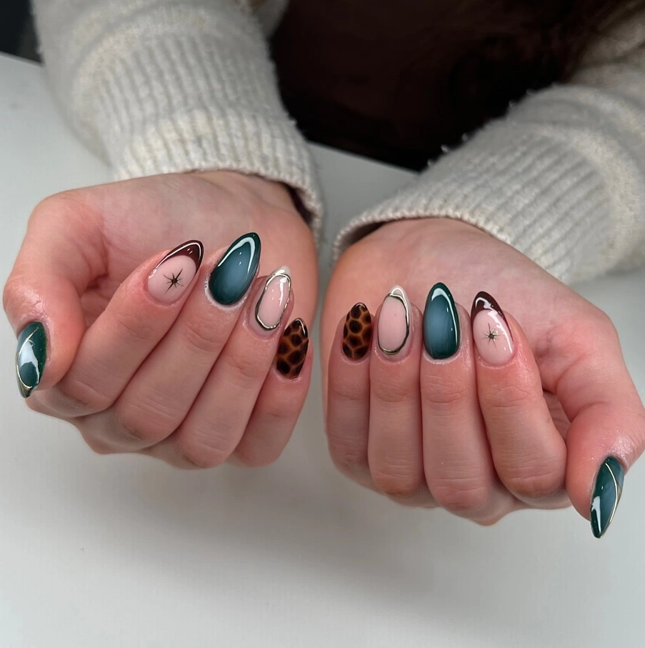 teal medium almond nails with flower, outline, animal print
